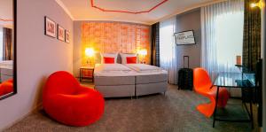 Postel nebo postele na pokoji v ubytování Hotel Maxplatz