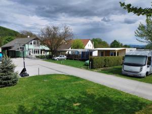 a white van parked on the side of a road at Guesthouse Braslovče - Celje in Braslovče