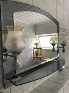 a mirror on a wall in a room at FeWo Martha in Zinnowitz