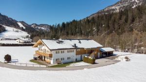 an aerial view of a house in the snow at Apartments Edinger in Söll