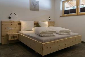 Postel nebo postele na pokoji v ubytování Apartments Edinger