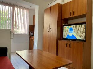 A television and/or entertainment center at Sea Garden One Bed Apartment