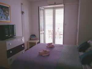 Posteľ alebo postele v izbe v ubytovaní Apartments Sv.Jakov