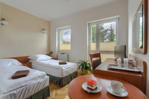 Un pat sau paturi într-o cameră la Sarenka