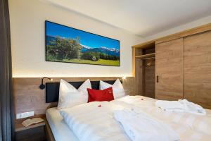 A bed or beds in a room at Apart Zwingerhof