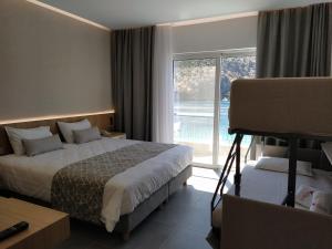 Postel nebo postele na pokoji v ubytování Minoa Hotel