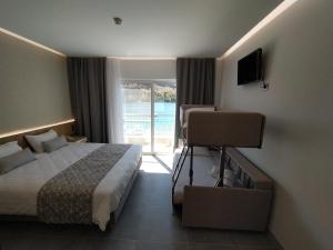 Postel nebo postele na pokoji v ubytování Minoa Hotel