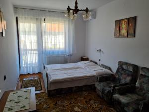 Posteľ alebo postele v izbe v ubytovaní Gyöngyvirág Apartman Lenti