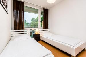 Llit o llits en una habitació de Budget Apartments Deutz