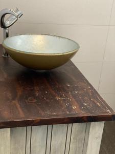 a bowl on top of a wooden table at 66Windemere self catering apartments in Durban