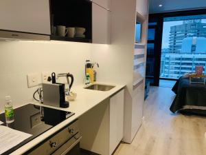 Una cocina o zona de cocina en Urban Elephant 16 On Bree