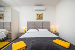 Posteľ alebo postele v izbe v ubytovaní Apartment Exclusive Nia