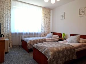 Säng eller sängar i ett rum på Willa "Zimowit" w Wiśle