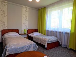 Łóżko lub łóżka w pokoju w obiekcie Willa "Zimowit" w Wiśle