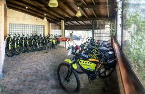 a group of bikes parked in a garage at Hotel Overland in Toirano