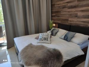 a bedroom with a bed with a pillow on it at Armeria Residence Snow in Štrbské Pleso