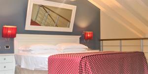 Un pat sau paturi într-o cameră la Hotel Fiera Di Brescia