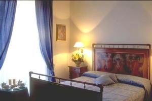 Postel nebo postele na pokoji v ubytování Hotel Clitunno