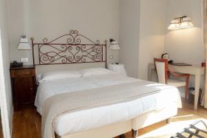 Postel nebo postele na pokoji v ubytování Hotel Clitunno