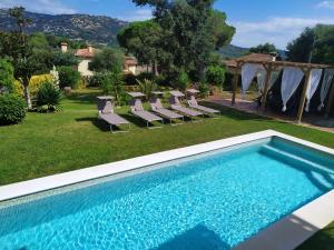 a swimming pool in the yard of a villa at Gramoia in S'Agaro