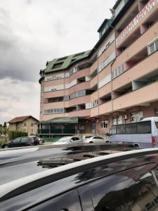 a car parked in front of a building at Apartman Zivanovic1 in Banja Koviljača +4 photos