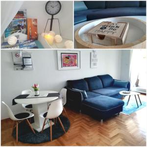 ein Wohnzimmer mit einem blauen Sofa und einem Tisch in der Unterkunft Apartment Angelus in Zagreb