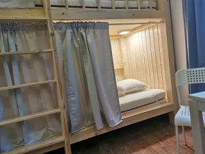 Voodi või voodid majutusasutuse 7brunnen Hostel Beds & Rooms toas