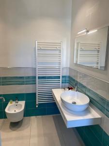 a bathroom with a sink and a mirror at 103 Boutique Hotel Stintino in Stintino