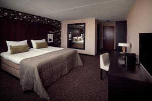 Postel nebo postele na pokoji v ubytování Van der Valk Hotel Emmeloord