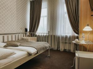 En eller flere senge i et værelse på Минима Китай-Город