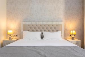 Postel nebo postele na pokoji v ubytování Hotel Rustaveli + 37 fotografií
