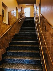 a row of stairs leading up to a stair case at Минима Китай-Город in Moscow