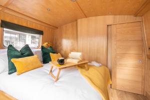 a bedroom with a bed and a desk at The Four Sisters Boatel - Houseboat in Edinburgh