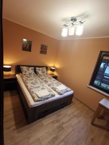 Posteľ alebo postele v izbe v ubytovaní NA GWiZDÓWCE DOM 35, ZAŁAKOWO, KASZUBY