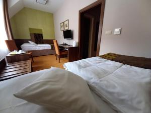 Ένα ή περισσότερα κρεβάτια σε δωμάτιο στο Hotel BELASSI