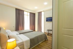 Voodi või voodid majutusasutuse Hotel Rustaveli toas