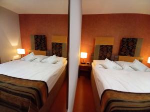 Ένα ή περισσότερα κρεβάτια σε δωμάτιο στο Hotel BELASSI