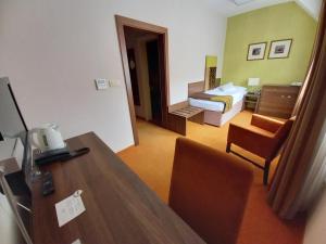 Ένα ή περισσότερα κρεβάτια σε δωμάτιο στο Hotel BELASSI
