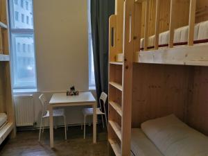 Voodi või voodid majutusasutuse 7brunnen Hostel Beds & Rooms toas