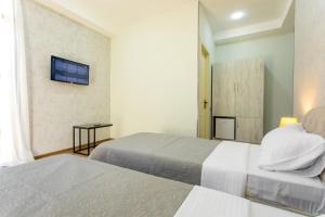Voodi või voodid majutusasutuse Hotel Rustaveli toas