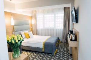 Postel nebo postele na pokoji v ubytování Hotel Vivaldi