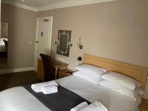 Letto o letti in una camera di Sutherland House