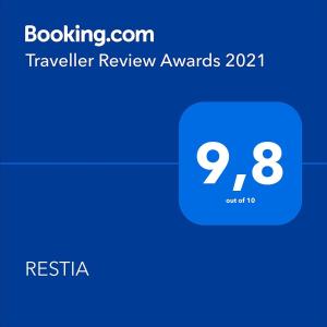 a screenshot of a text box with a travel review award at RESTIA in Agios Petros