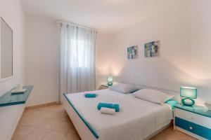 Postel nebo postele na pokoji v ubytování Apartmani Tanja