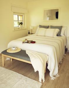A bed or beds in a room at Pape holiday home