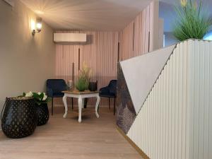 Posezení v ubytování Hotel La Perla