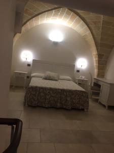 Postel nebo postele na pokoji v ubytování PLAZACARRISI HOTEL & SPA