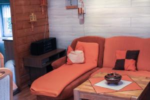 a living room with a couch and a table at Ferienhaus Oertel in Annaberg-Buchholz