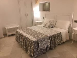 Postel nebo postele na pokoji v ubytování PLAZACARRISI HOTEL & SPA