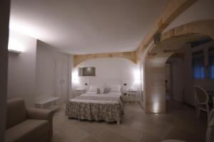 Postel nebo postele na pokoji v ubytování PLAZACARRISI HOTEL & SPA